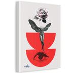 A vertical canvas wall art print featuring a surreal illustration of a woman with wings holding a rose above a red abstract shape, with an eye motif below. The canvas is shown at a slight angle against a clean white background.