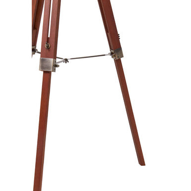 Malvern Brown Wood Tripod Floor Lamp with white linen shade and natural brown pine wood tripod legs in a warm living room setup