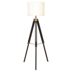 Malvern Black Wood Tripod Floor Lamp with white linen shade and black pine wood tripod legs in a modern living room