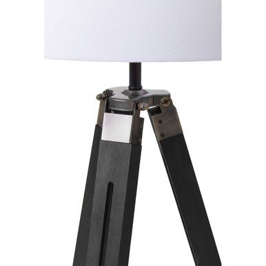 Malvern Black Wood Tripod Floor Lamp with white linen shade and black pine wood tripod legs in a modern living room