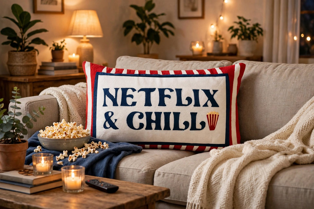 Netflix & Chill hand-stitched needlepoint throw pillow featuring red stripes and popcorn details with a soft reversible velvet backing